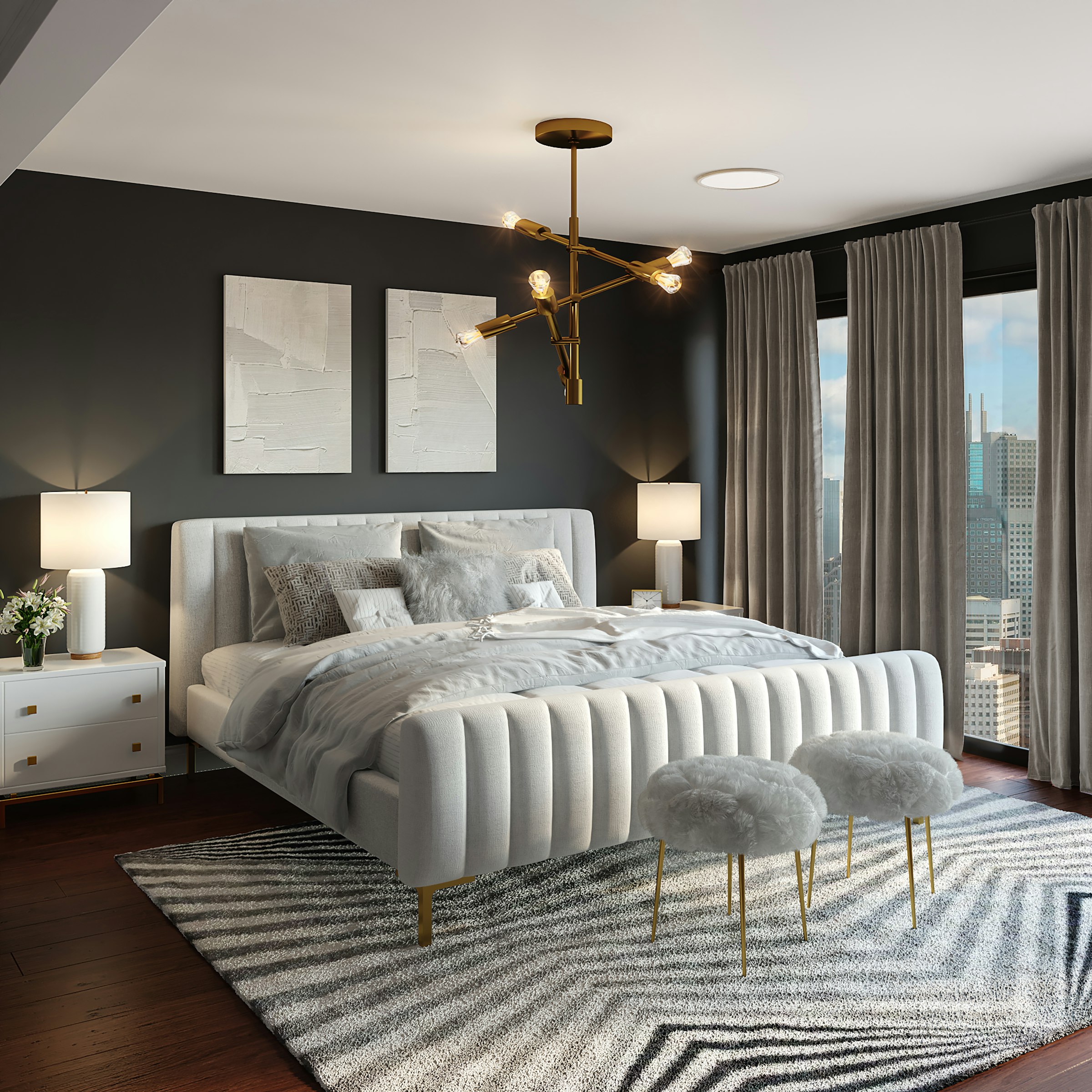 Luxury bedroom with a channel-tufted headboard, dark feature wall and gold chandelier