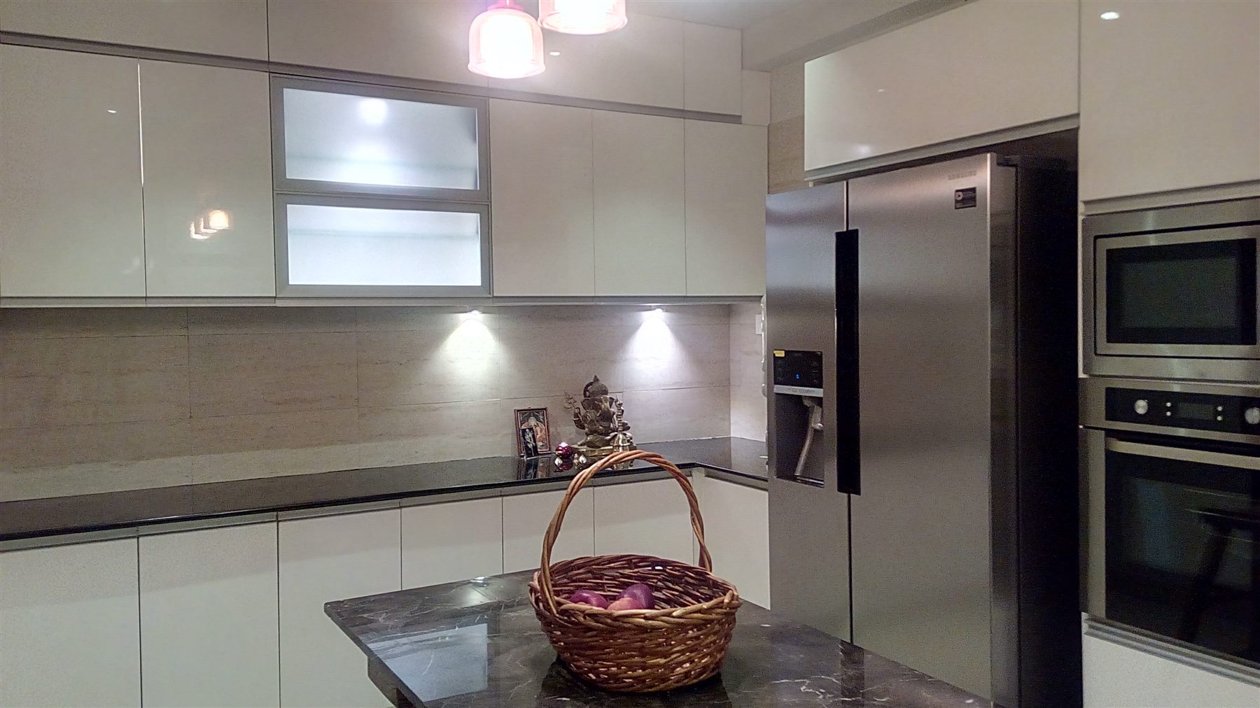 White PU-paint kitchen with frosted-glass uppers, built-in oven tower and granite island