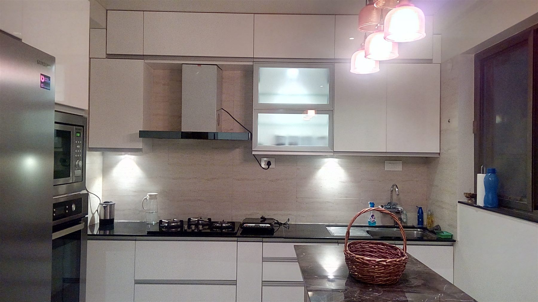 White PU-paint kitchen with spotlights and a chimney