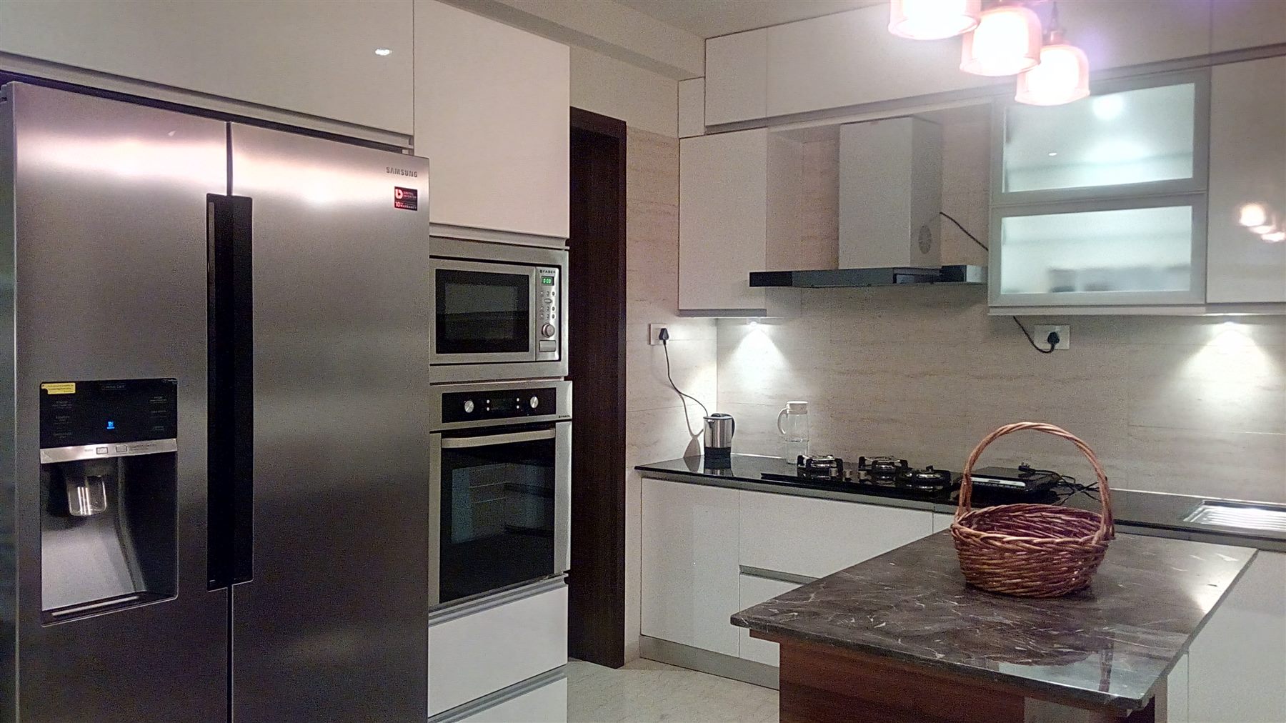 Side-by-side fridge niche beside the oven tower