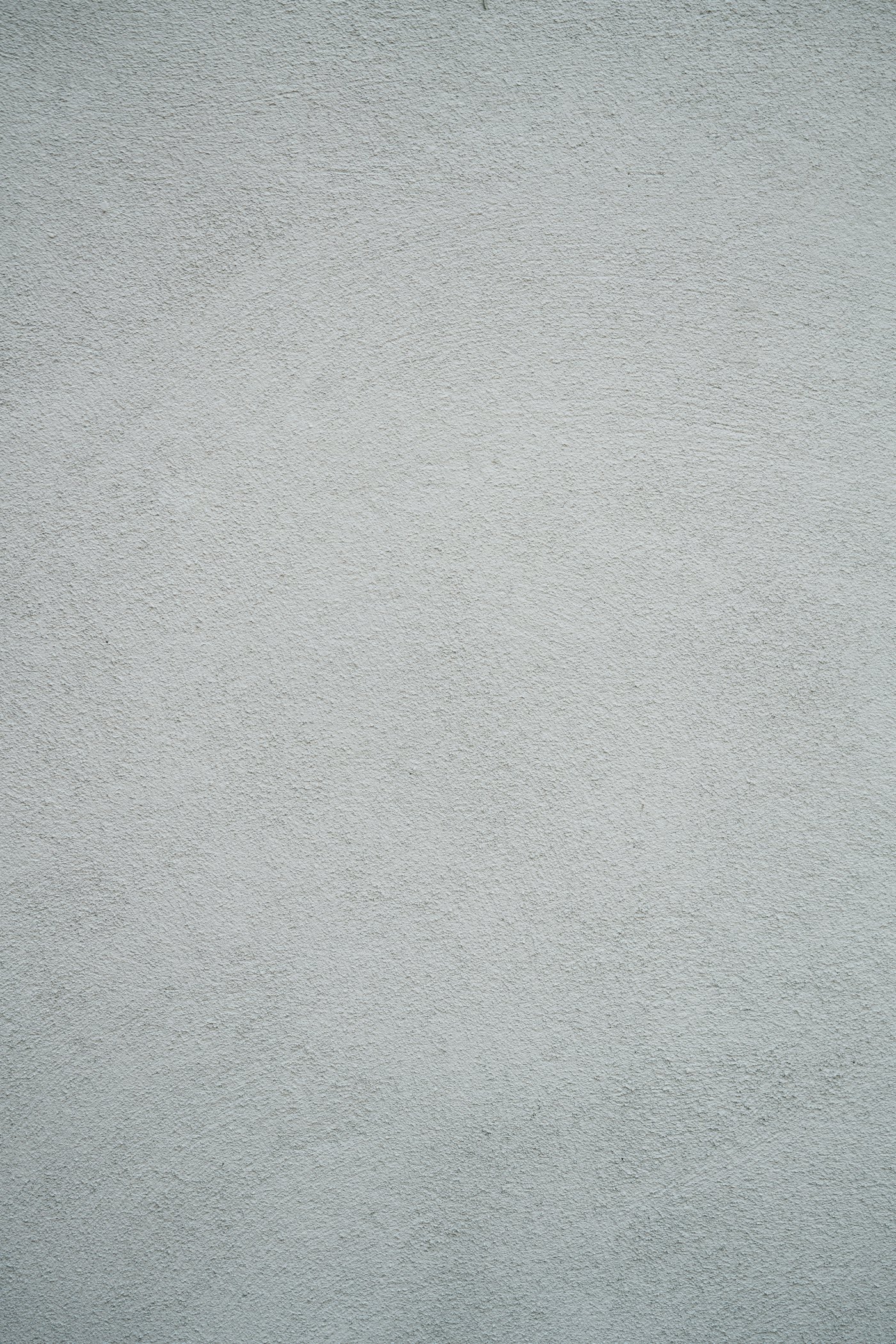 Close-up of a grey textured plaster wall finish