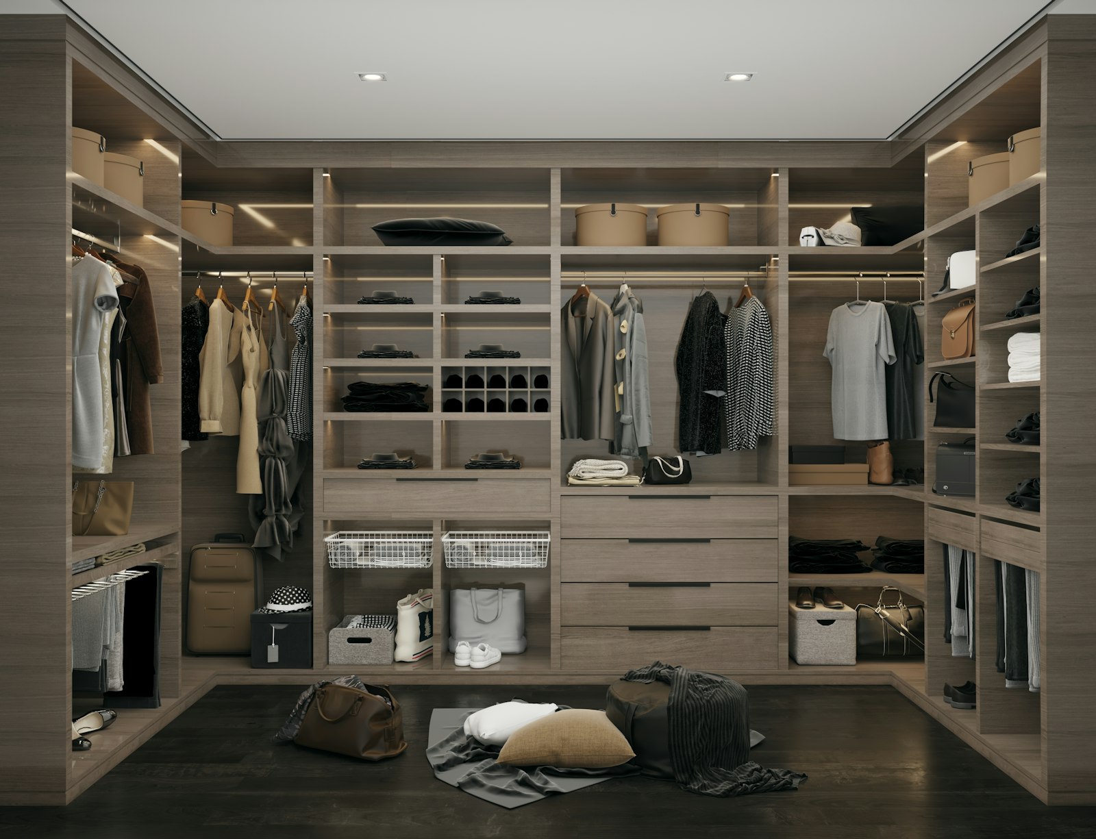 U-shaped walk-in wardrobe in wood finish with lit shelves, hanging rails and drawers