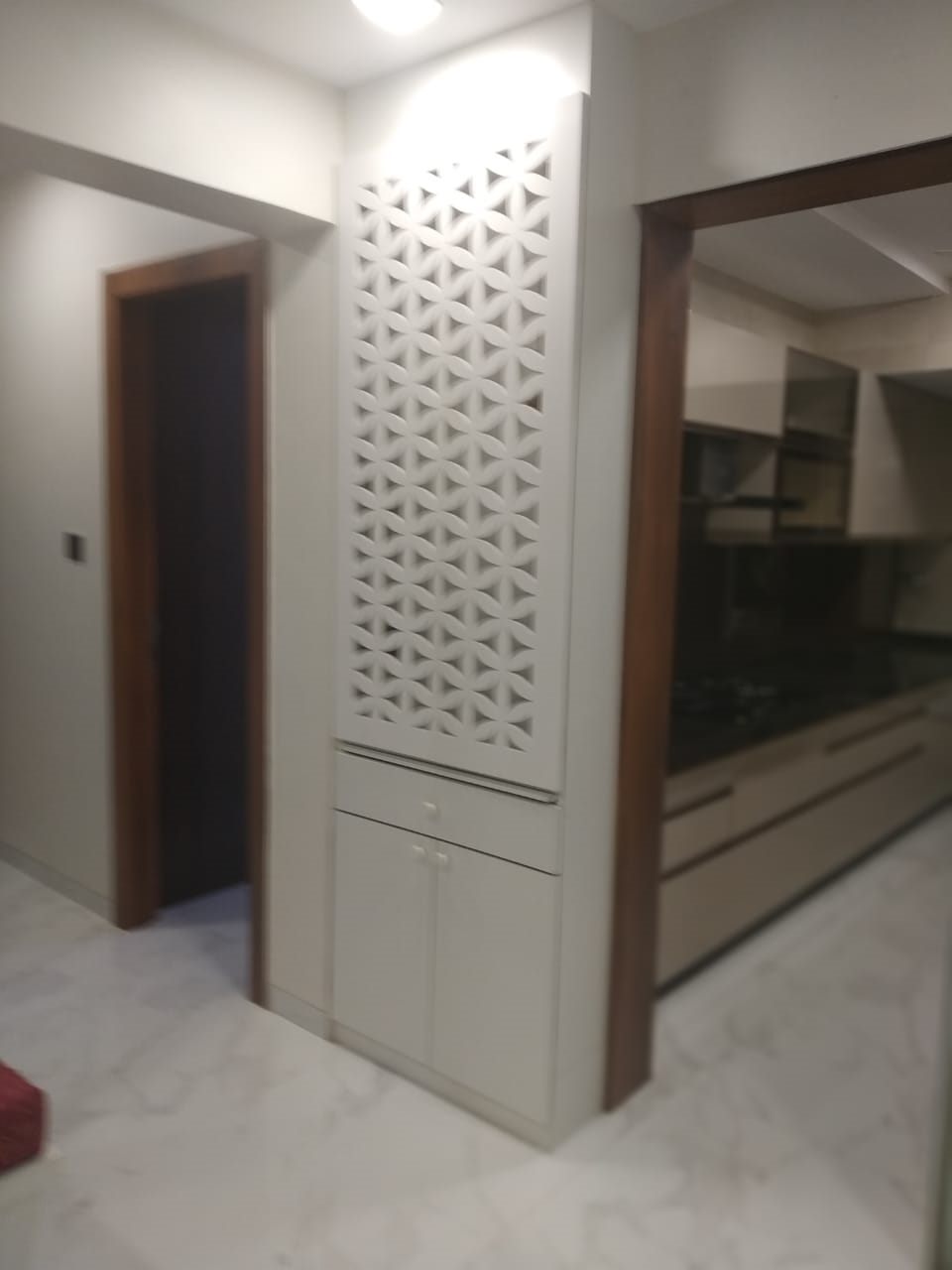 Jali partition beside the bedroom wardrobe